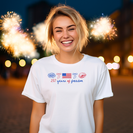 Woman wearing a white t-shirt with a design in front of fireworks