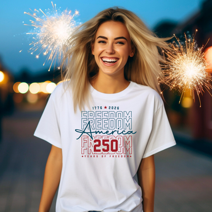 Woman wearing a white t-shirt with 'Freedom America' text, surrounded by sparklers.